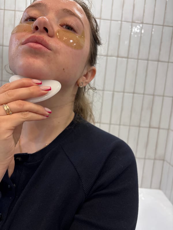 Morning self-care routine documented alongside household cat in Izhevsk