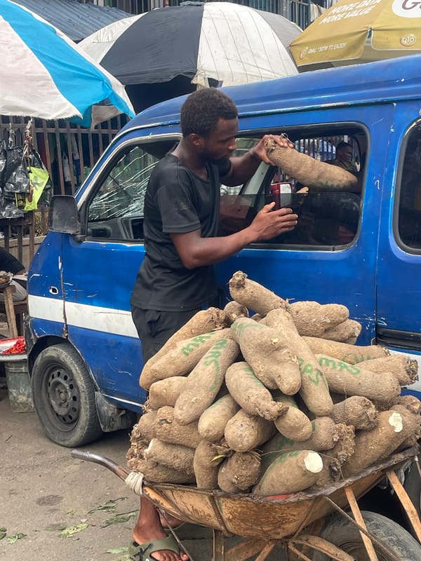 West African market scene captures daily life moments