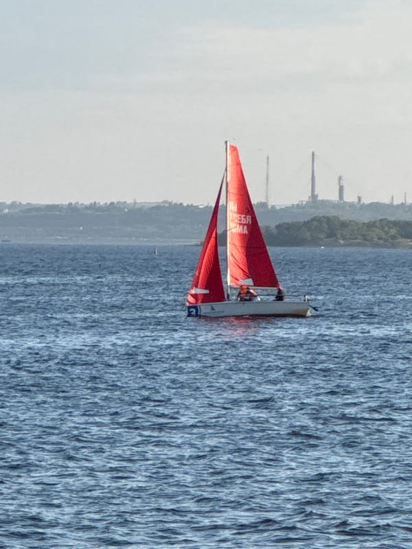 Sailing and street life along Saratov's Volga River embankment