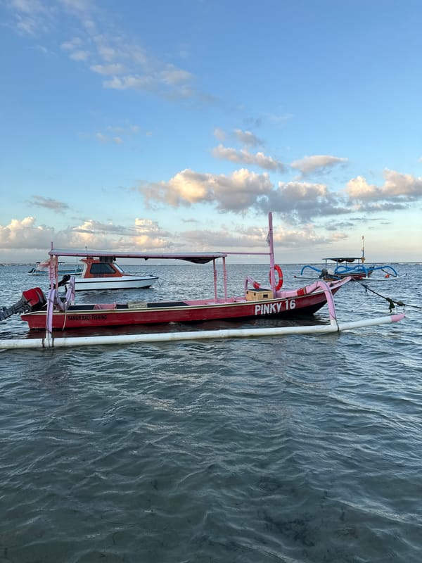Traditional outrigger boats spotted in calm Denpasar waters