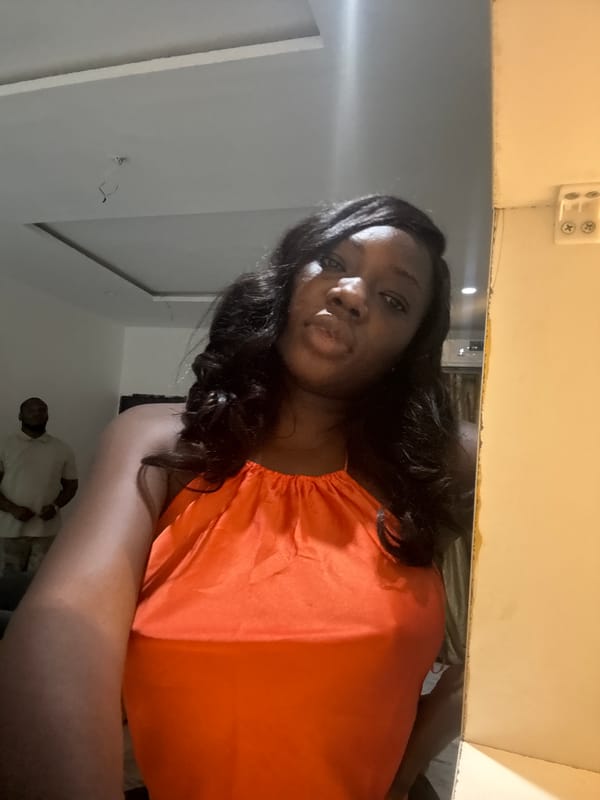 Woman takes selfies at home in Nigeria