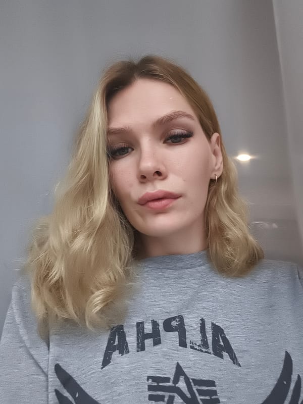Woman in ALPHA shirt photographed in Русский Вожой