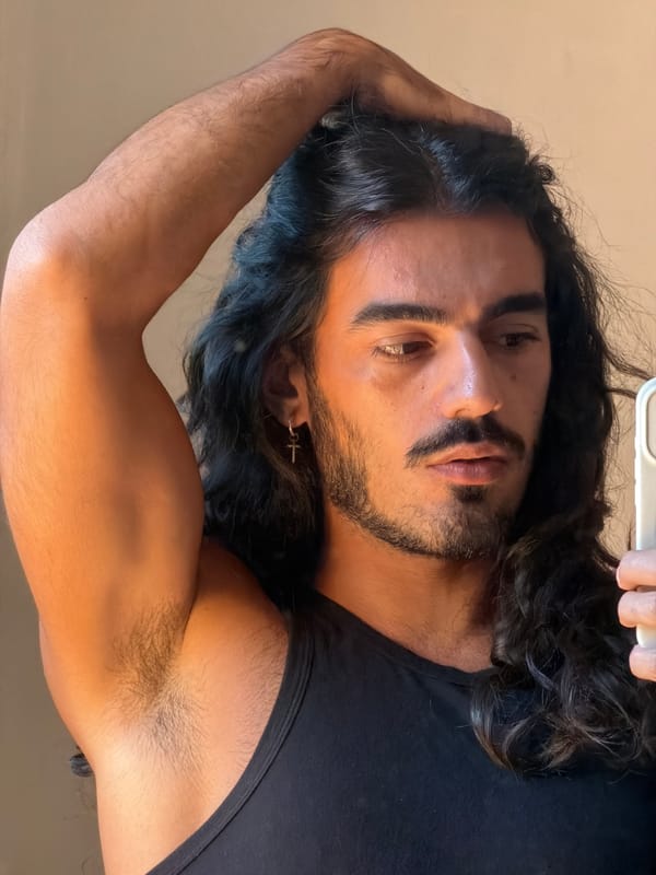Man takes multiple selfies in North Kuta, Indonesia