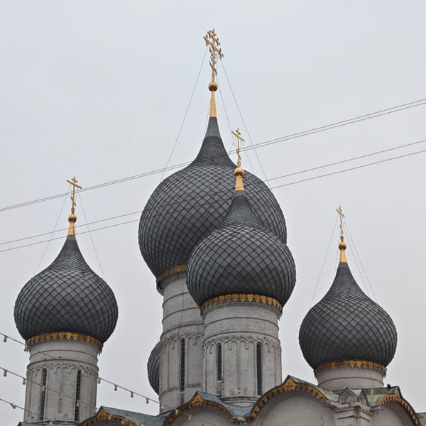 Cyclist documents Rostov Kremlin's medieval architecture during afternoon visit