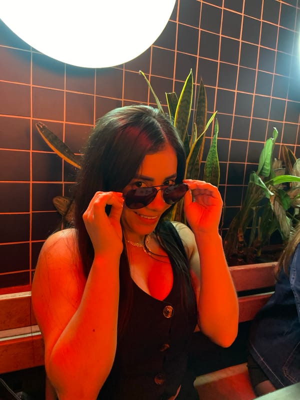 Woman enjoys late night dining experience in Bogota restaurant