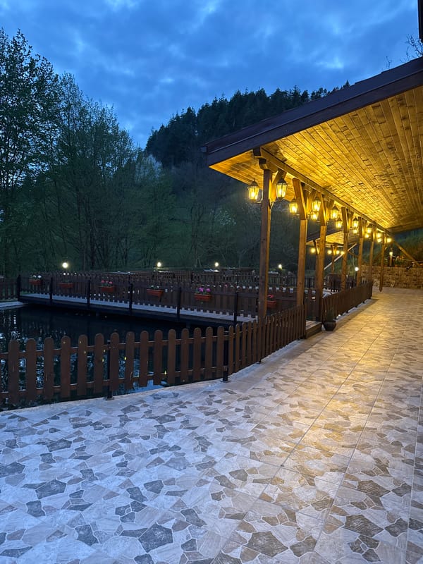 Evening dining venue captured in twilight outdoor and indoor scenes