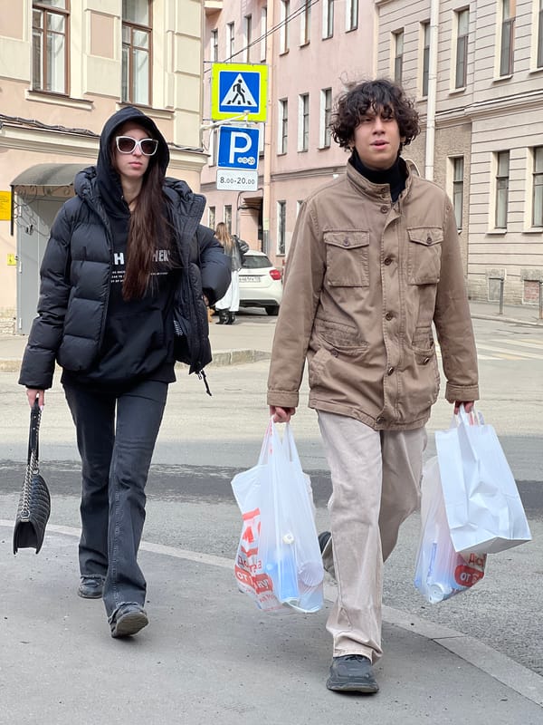 Pedestrians and dog walker captured on Saint Petersburg streets