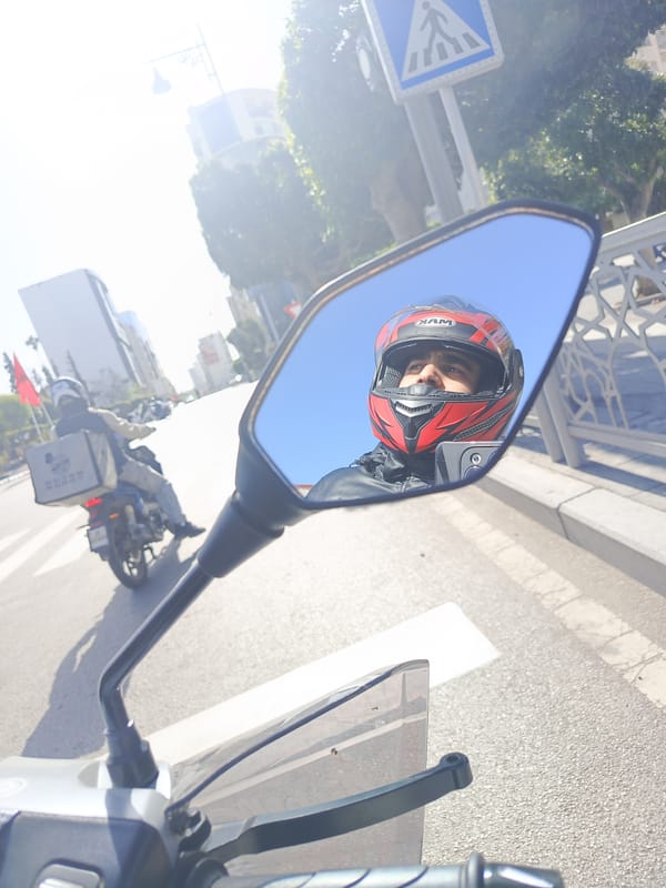 Motorcyclist captures street scenes and public square in Meknes