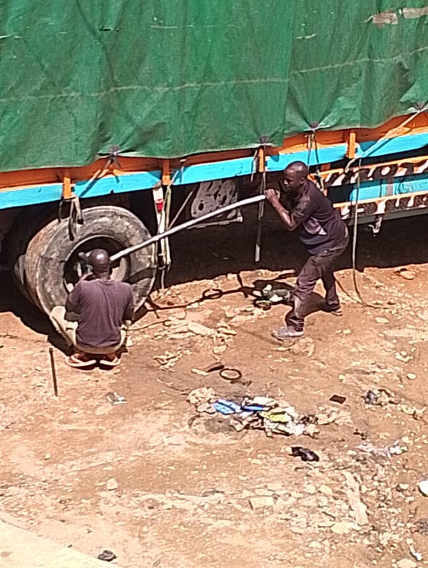 Goods moving through a busy Jos distribution hub