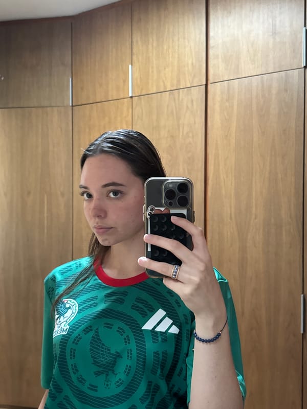 Person Takes Selfies in Mexico Soccer Jersey