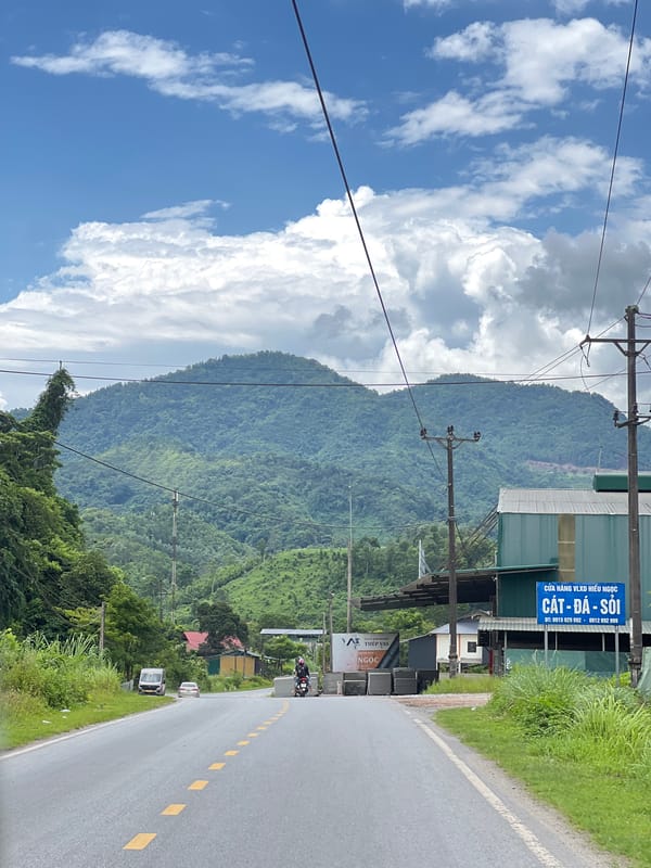 Winding road through green mountain terrain in Thuận Hòa, Vietnam