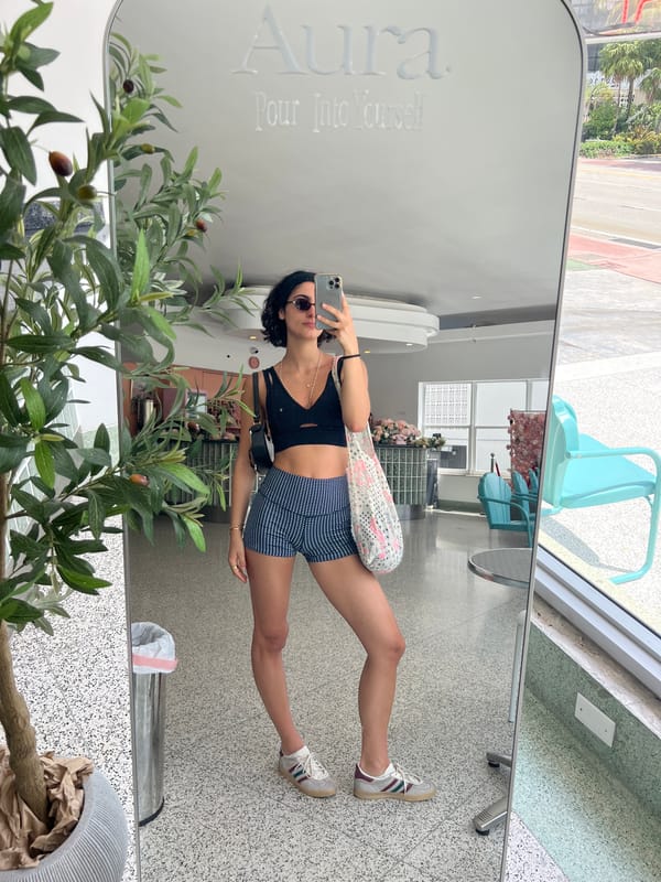 Woman takes selfie in modern Miami Beach interior