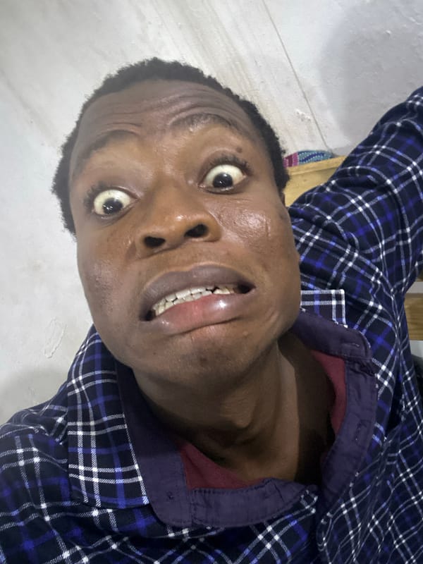 Person in plaid shirt observed lying on white surface