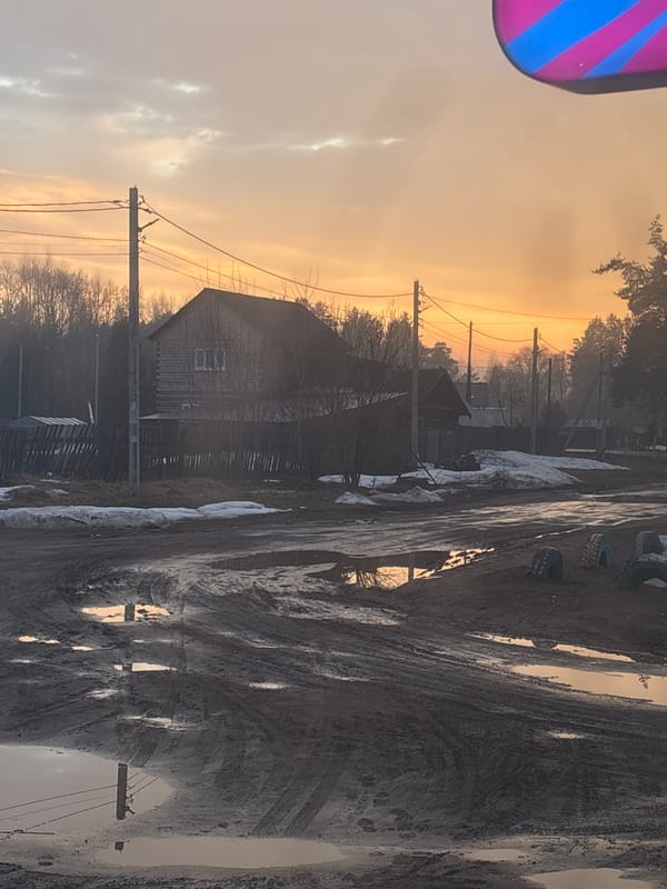 Rural street scenes documented in Rusalevka, Russia during golden hour