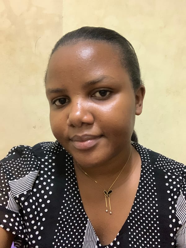 Woman takes selfies in bedroom in Dar es Salaam