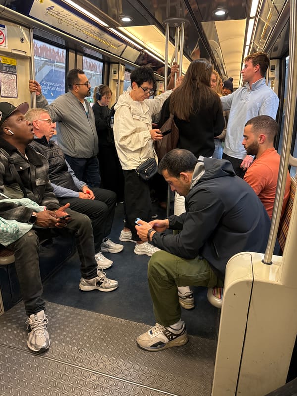 Evening commuters fill Paris subway car during regular transit