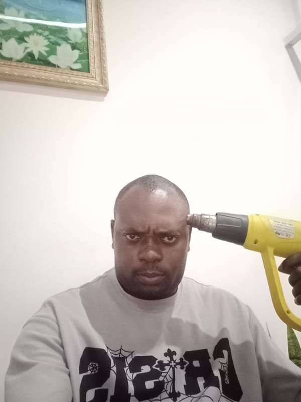 Man photographed with heat gun in Gwarinpa, Nigeria
