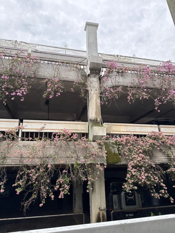 Kuala Lumpur architecture captured: flowering building facade, iconic tower