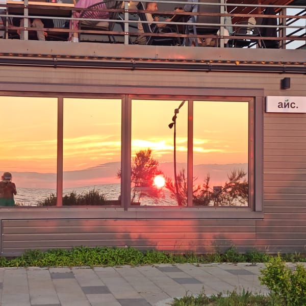 Beach sunset gathering draws multiple groups of observers