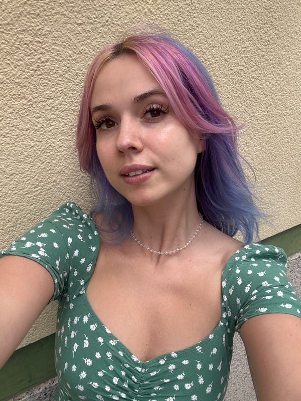 Woman takes selfie in floral dress, Oviedo Spain