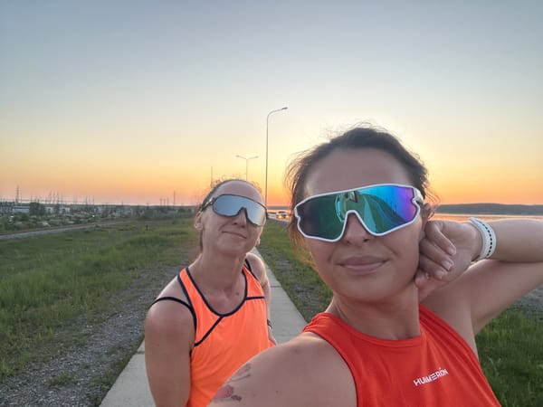 Women take sunset selfies in athletic wear, Chaikovsky Russia