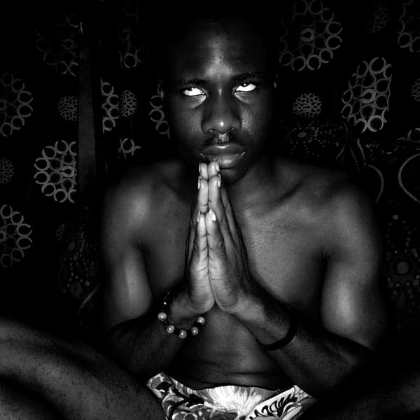 Person resting on patterned bedding captured in Narayi, Nigeria