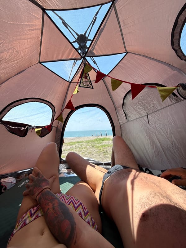 Lazy beach day: tent views and a smiling seaside selfie