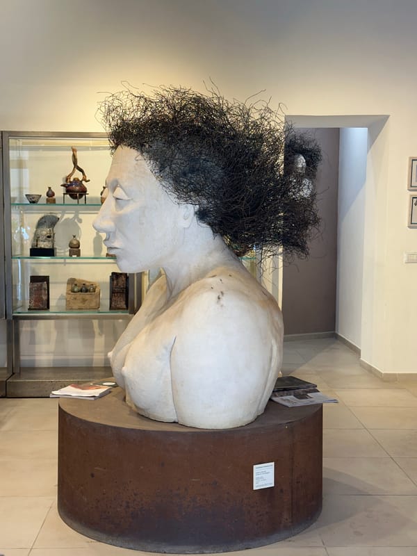 Tourist documents sculptures and fountains in historic Syracuse