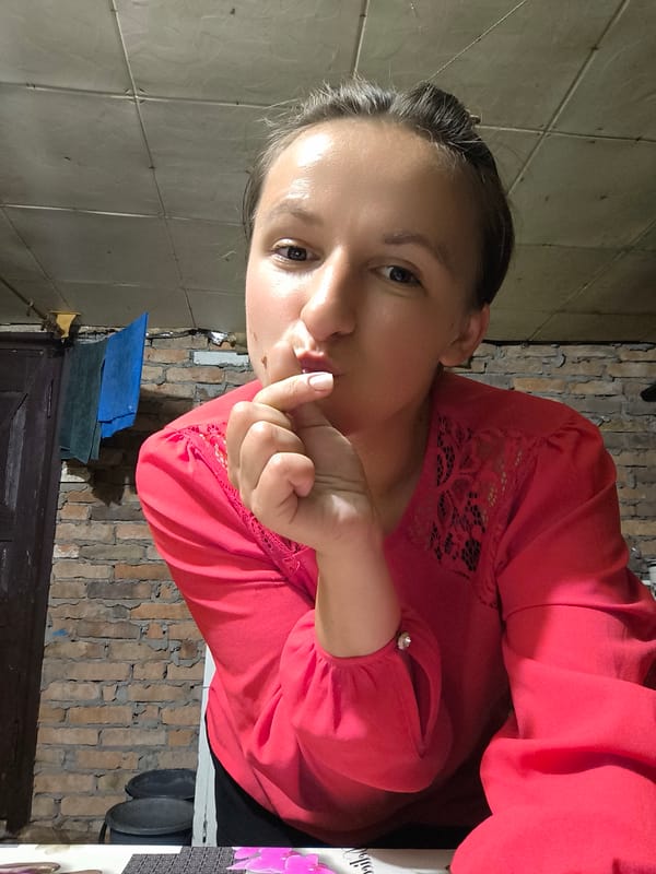 Casual selfie session inside a brick-walled room in Anastasivka