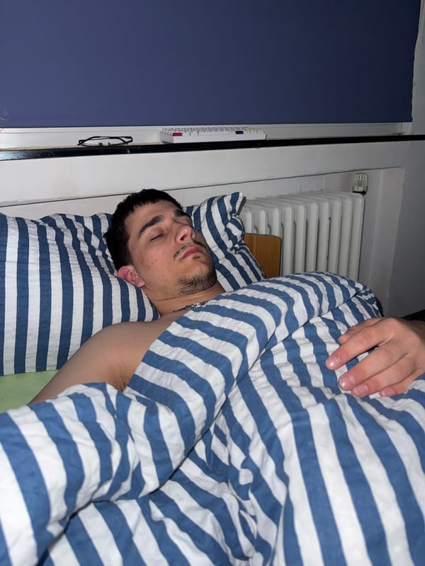Man sleeps in striped bedding in Rückingen, Germany