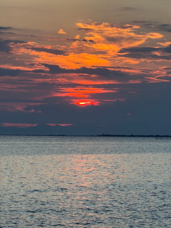Red sunset over calm Aegean waters near Νέα Ηράκλεια