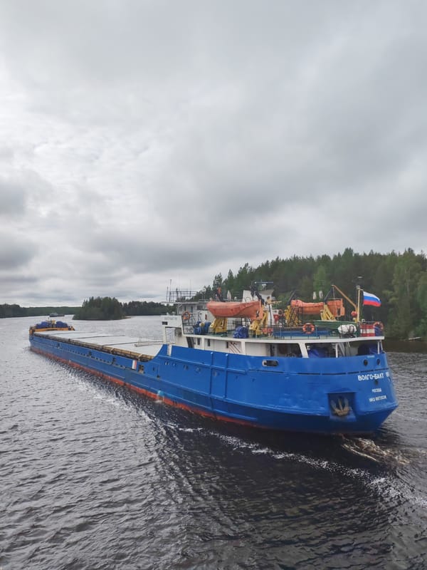 Volgo-Balt cargo ships transit waterway near Devyatiny, Russia