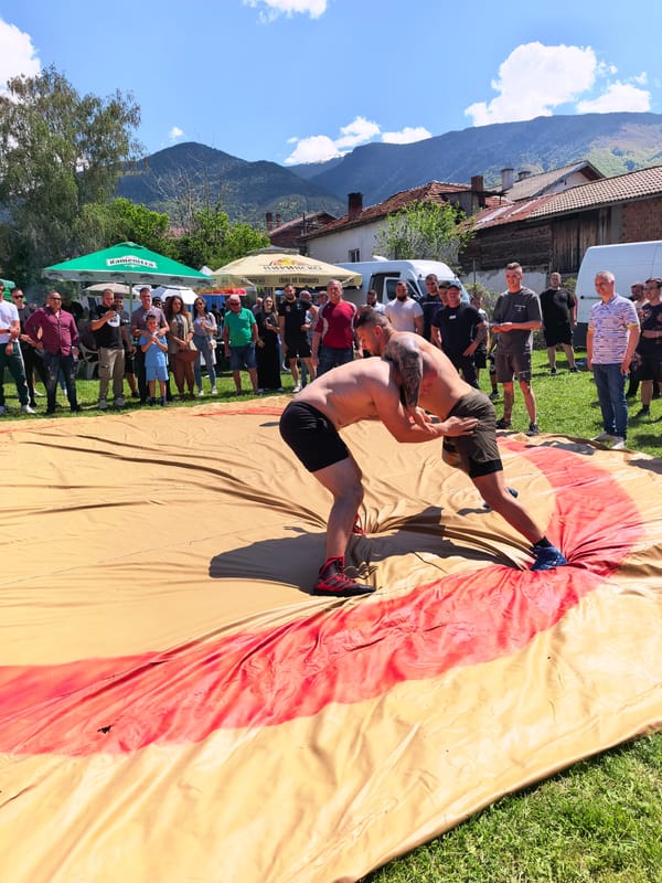Outdoor wrestling match draws crowd in Sapareva Banya, Bulgaria