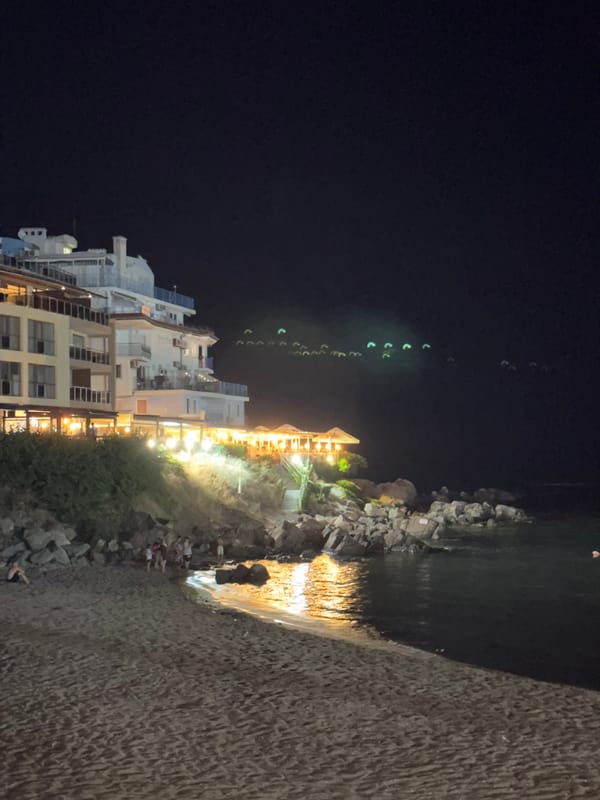 Red moon rises over Sozopol beach on a July night