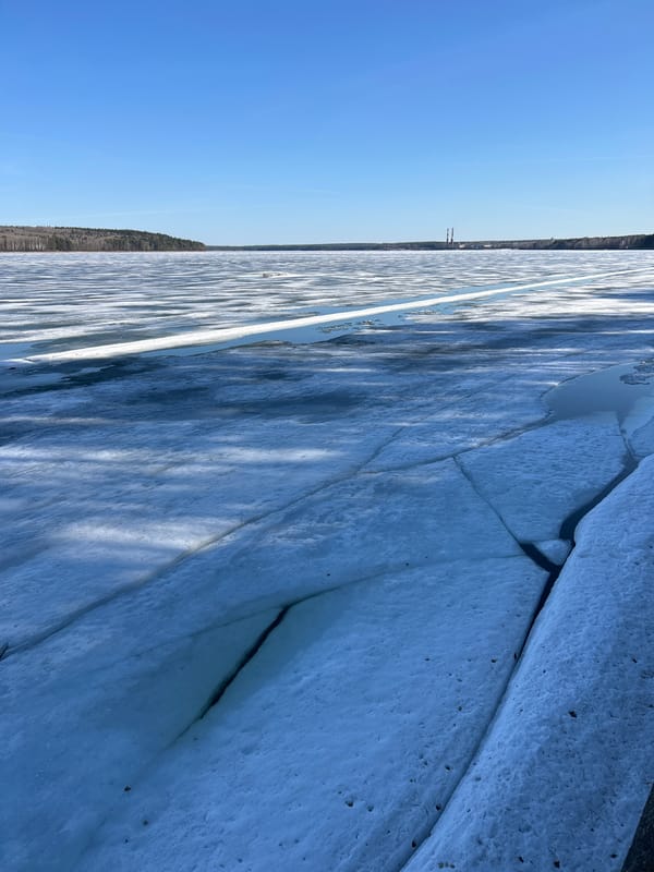 Spring day documented in Chaikovsky with ice breakup, clear skies