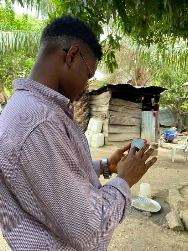 Community meeting held in Mararaba, Nigeria building