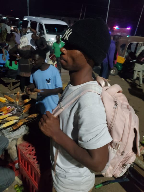 Evening street market bustles with vendors and rickshaws in Bukuru