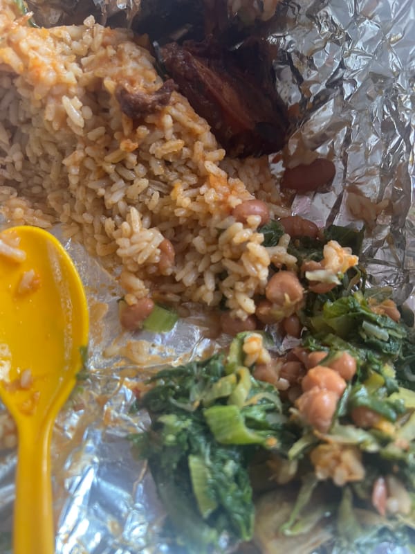Takeout meal documented in aluminum container in Dar es-Salaam