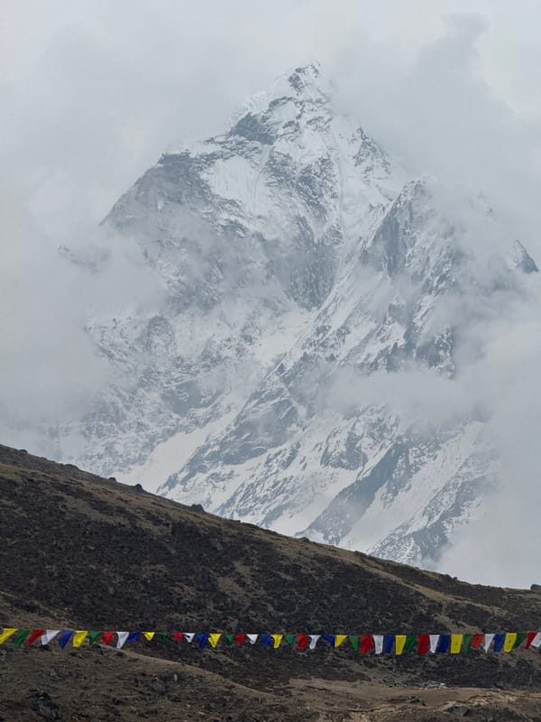 Morning scenes captured in Dughla: mountains, prayer flags, travel boards