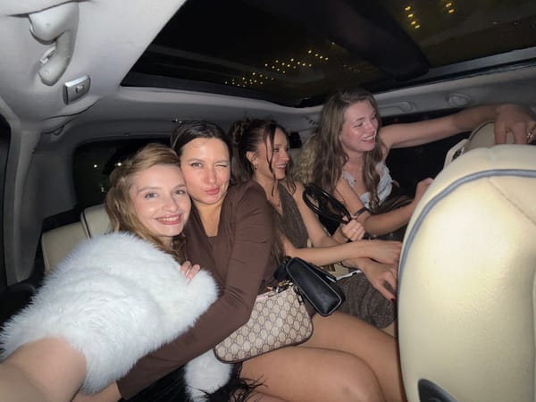 Young women gather in car during rainy Belgrade night