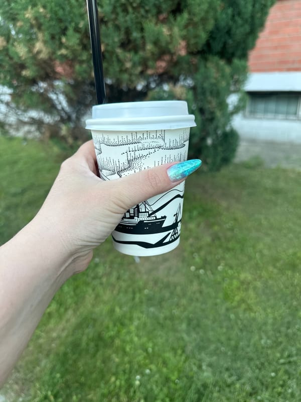 Person holds takeaway cup in Shchyolkovo, Russia
