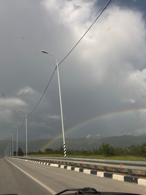 Rainbow appears over Gelendzhik coastal city amid overcast skies