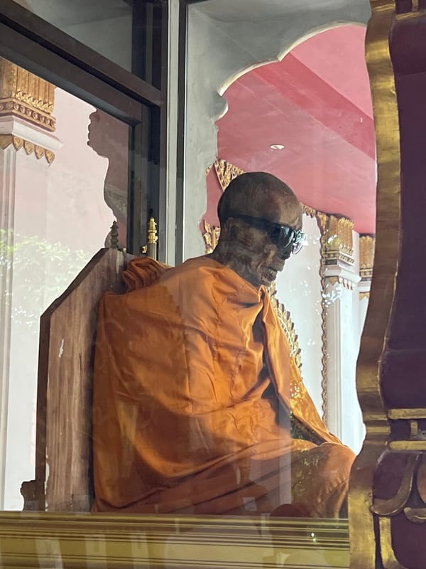 Mummified monk in glass enclosure, Ko Samui temple