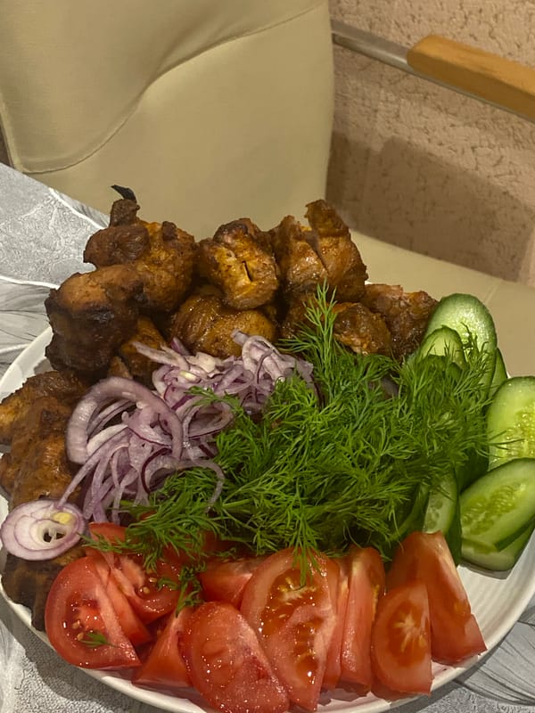 Family enjoys traditional grilled meal in Sochi home