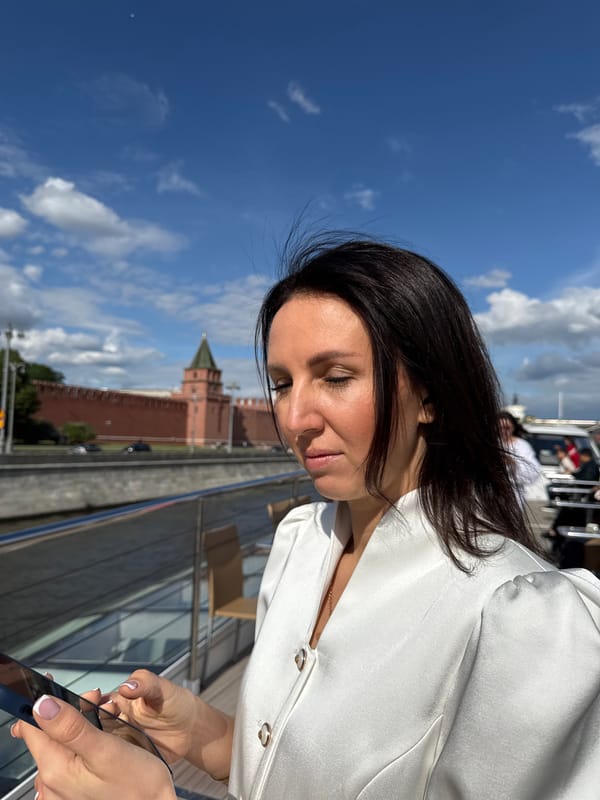 Woman checks phone near Moscow's Kremlin wall