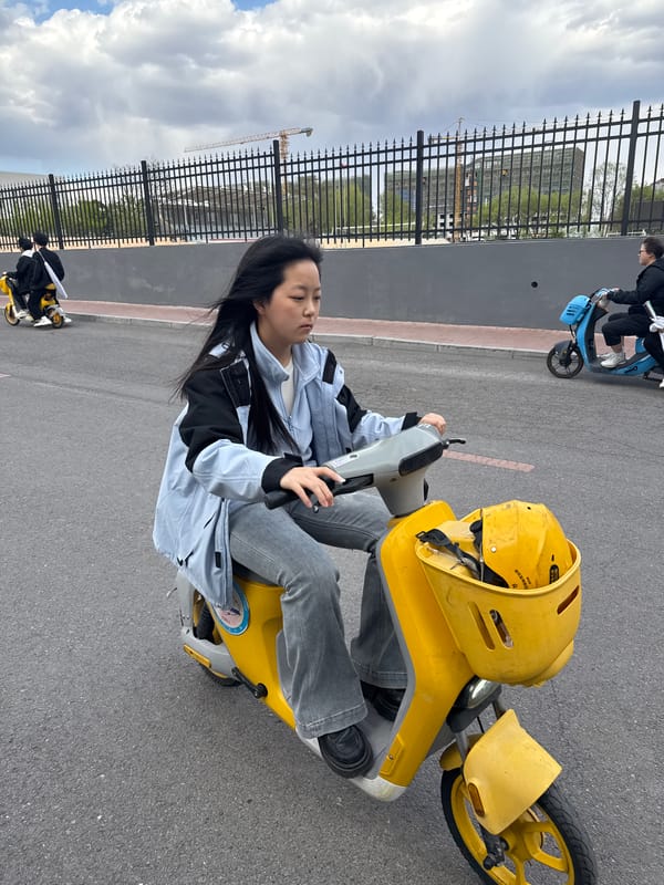 Women spotted on scooters, sidewalks in Zhongtun morning scenes