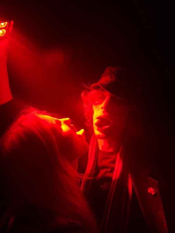 Paris nightclub scene captured in red-lit underground venue