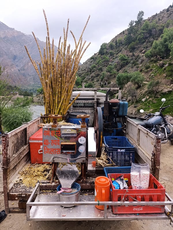 Roadside sugarcane juice stop beside a glacial river in Gondhla
