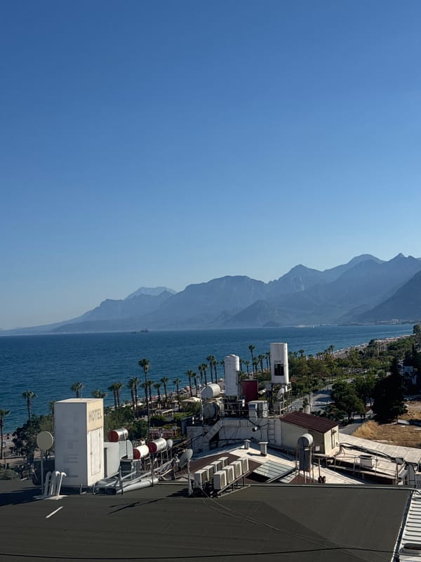 Konyaaltı beachfront and hotel scene on a sunny afternoon