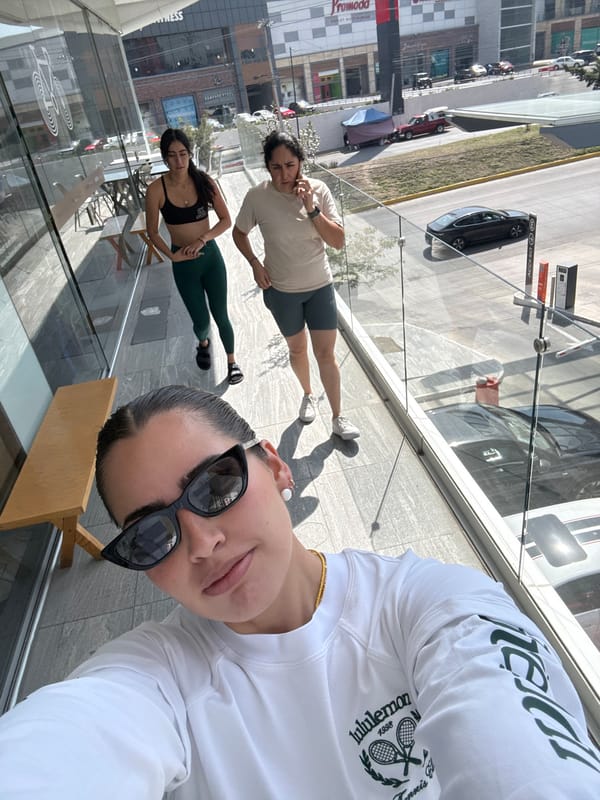 Three women photograph shopping trip at Puebla outlet mall